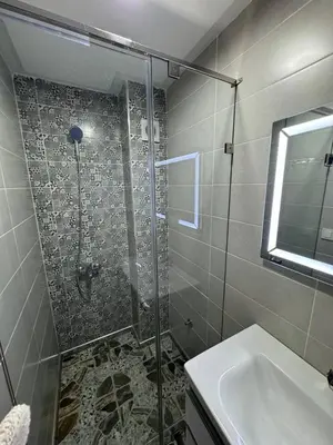 a bathroom with a shower and a sink at Dar location luxury in Meknès