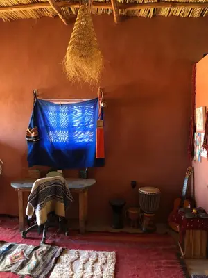 a room with a blue tarp hanging on a wall at Chill and welcoming flat in Tagounite in Tagounite
