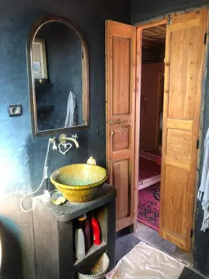 a bathroom with a sink and a mirror at Chill and welcoming flat in Tagounite in Tagounite
