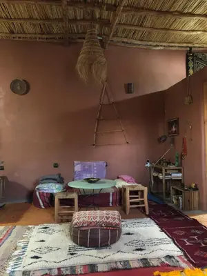 a room with a table and a basket on the wall at Chill and welcoming flat in Tagounite in Tagounite