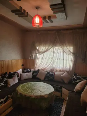 a living room with a couch and a window at Ourika atlas home in Setti Fatma