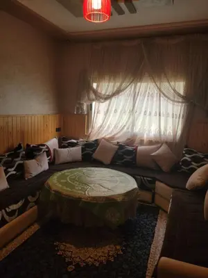 a living room with a couch and a table at Ourika atlas home in Setti Fatma