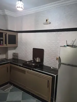 a kitchen with a stove and a refrigerator at Ourika atlas home in Setti Fatma