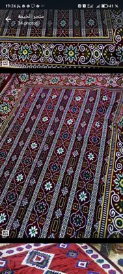 a close up of a carpet with a pattern on it at almou auberge imilchil in Imilchil