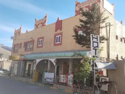 a building with a store on the side of a street at almou auberge imilchil in Imilchil