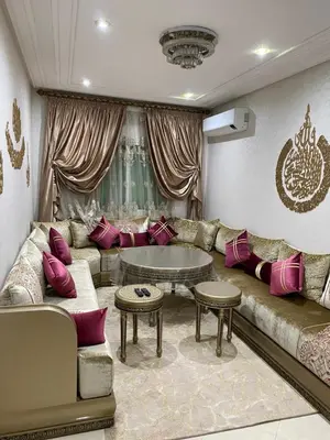 a living room with a couch and a table at Jnane meknes in Meknès