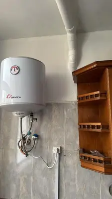 a water tank in the corner of a room at Appartement Ritage in Meknès