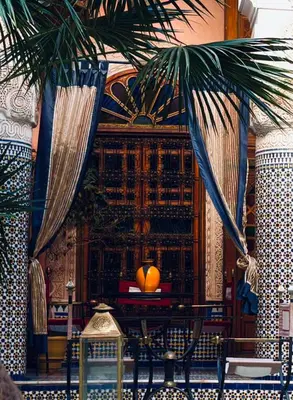a room with a table with an orange on it at Kassr Annoujoum - Luxury Boutique Riad in the Heart of Fès Medina in Fès