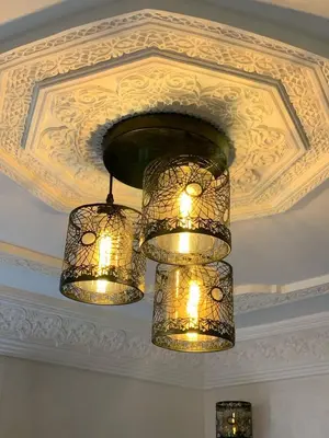 two chandeliers hanging from a ceiling at RIAD Jad in Fès