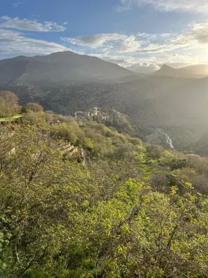 a view from the top of a mountain with trees at Dar Tissili in Aït Tamellil