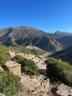 a view of a village with mountains in the background at Dar Tissili in Aït Tamellil