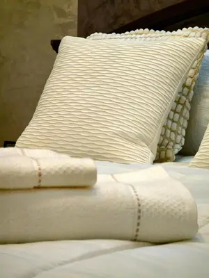 a bed with two white pillows and a white blanket at Charming Fassi Stay, 5 min Center in Fès