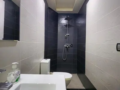 a bathroom with a shower and a toilet and a sink at Charming Fassi Stay, 5 min Center in Fès