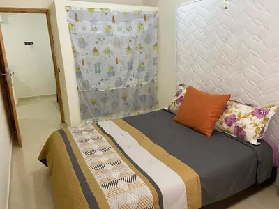 a bed with pillows on it in a room at Yahya in Srarhna