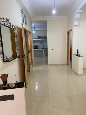 a large room with a mirror and a tile floor at Yahya in Srarhna