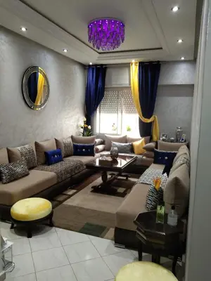 a living room with a couch and a table at Rim in Fès