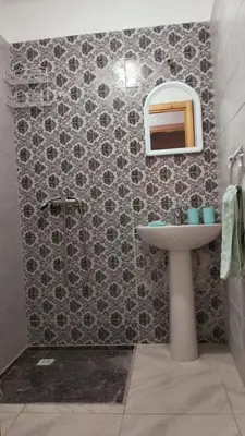a bathroom with a sink and a mirror at Rim in Fès