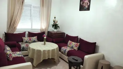 a living room with a couch and a table at Rim in Fès