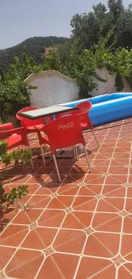 a table and two surfboards sitting on a patio at Park tazeka in Bistouna