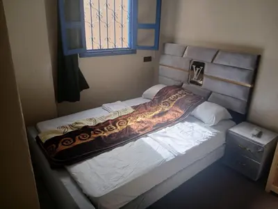 a bed sitting in a room with a window at Gite ritch in Rich