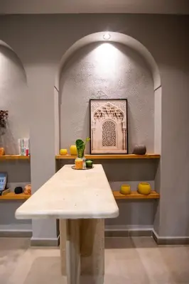 a table in a room with a shelf with fruits at Penthouse-fes in Fès