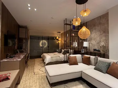 a living room with a couch and a bed at Penthouse-fes in Fès