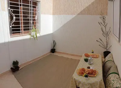 a room with a table with food on it at Beautiful apartment near airport in Fès