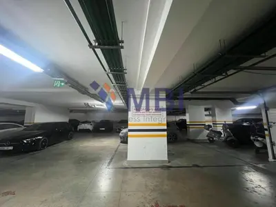 a parking garage with cars parked in it at Tanger Apt Near Train & Mall in Oulad Akkou