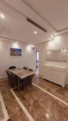 a conference room with a table and chairs in it at Tanger Apt Near Train & Mall in Oulad Akkou