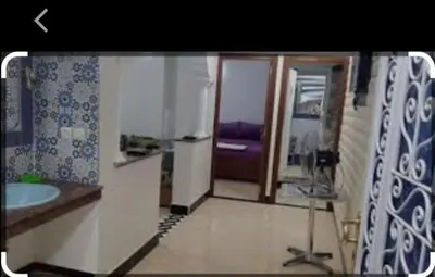 a bathroom with a sink and a mirror at Maison Zakaria in Zaouiat Cheikh