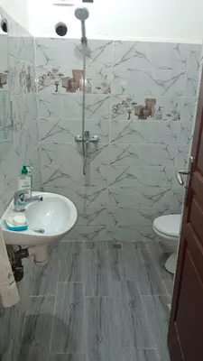 a bathroom with a sink and a toilet at Appartement Ghita in Fès