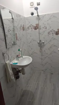 a bathroom with a sink and a mirror at Appartement Ghita in Fès