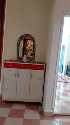 a mirror on top of a cabinet in a room at Joli appartement de 120 m2 in Meknès