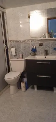 a bathroom with a toilet and a sink at Joli appartement de 120 m2 in Meknès