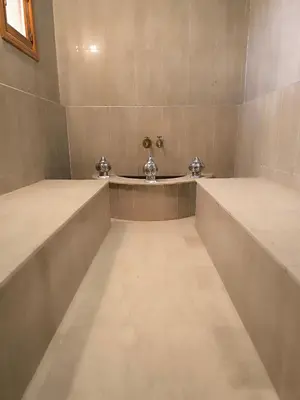 a large bathroom with two sinks in a room at Domaine du souffle d Amaia in Had Abdallah Rhiat