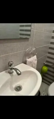 a bathroom with a white sink at Welcome Home in Oulad Hammou