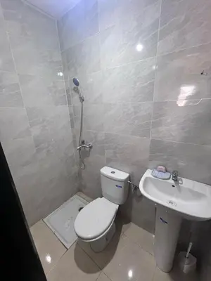 a bathroom with a toilet and a sink at Bloc A3 AP161 ET4 nakhil lamsala Meknès in Meknès