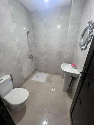a bathroom with a toilet and a sink at Bloc A3 AP161 ET4 nakhil lamsala Meknès in Meknès