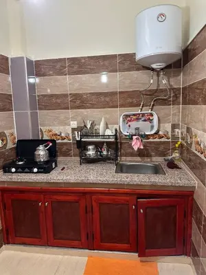 a kitchen with a sink and a counter top at Residence Dallas Warzazate in Ouarzazate