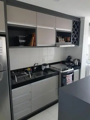 a kitchen with a sink and a stove at Halima1 in Oulad Akkou