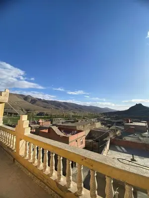 a view of a city from a balcony at Maison d'hôtes Moussem des fiançailles in Imilchil