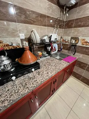 a kitchen with a sink and a counter top at Hostel dallas Warzazate in Ouarzazate