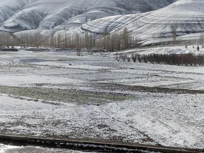 a snowy field with snow on the ground at almou auberge Imilichil in Imilchil