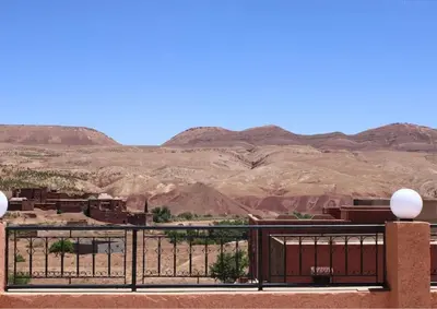 a view of the desert from the balcony of a house at Hotel Kasbah Telouet in Telouet