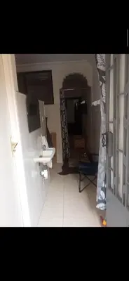 a bathroom with a sink and a mirror at Dar lbahia in Oulad Akkou