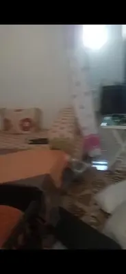 a blurry picture of a person in a living room at Dar lbahia in Oulad Akkou