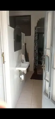 a bathroom with a white sink in a room at Dar lbahia in Oulad Akkou