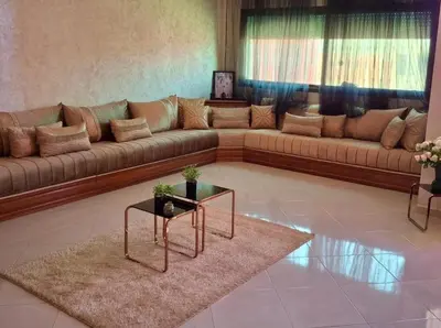 a large living room with a couch and a table at A new, lively apartment in Oulad Akkou