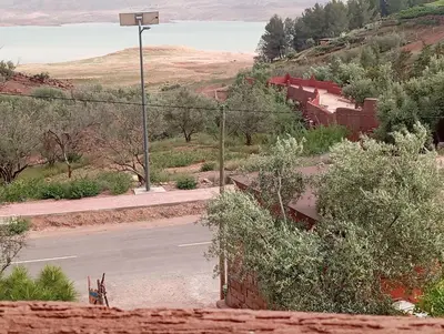 an empty road with a view of a lake at Appartement de location in Ouaouizaght