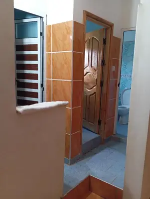 a bathroom with a shower and a toilet in a room at Appartement de location in Ouaouizaght